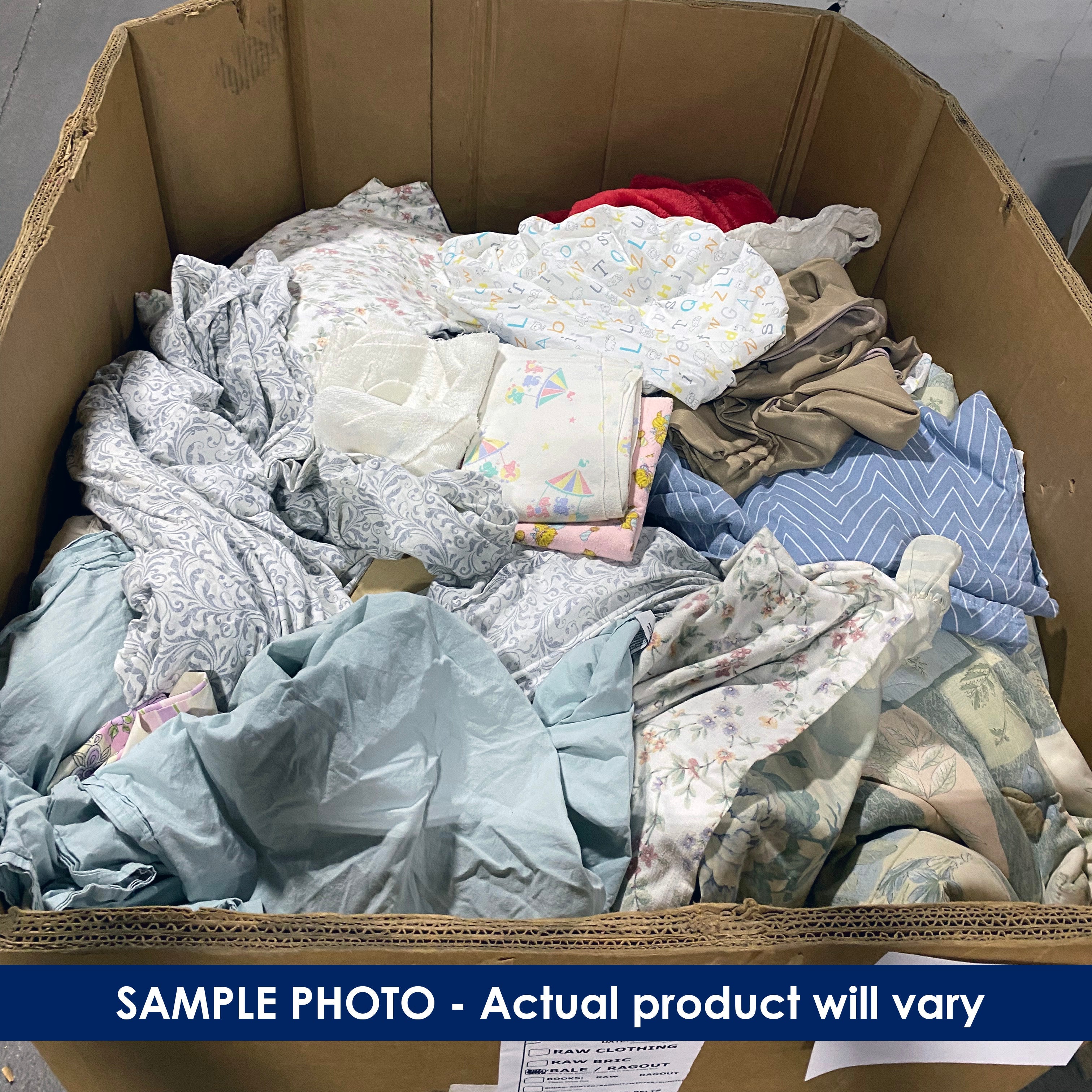 Pallet box filled with assorted linen and beddings.