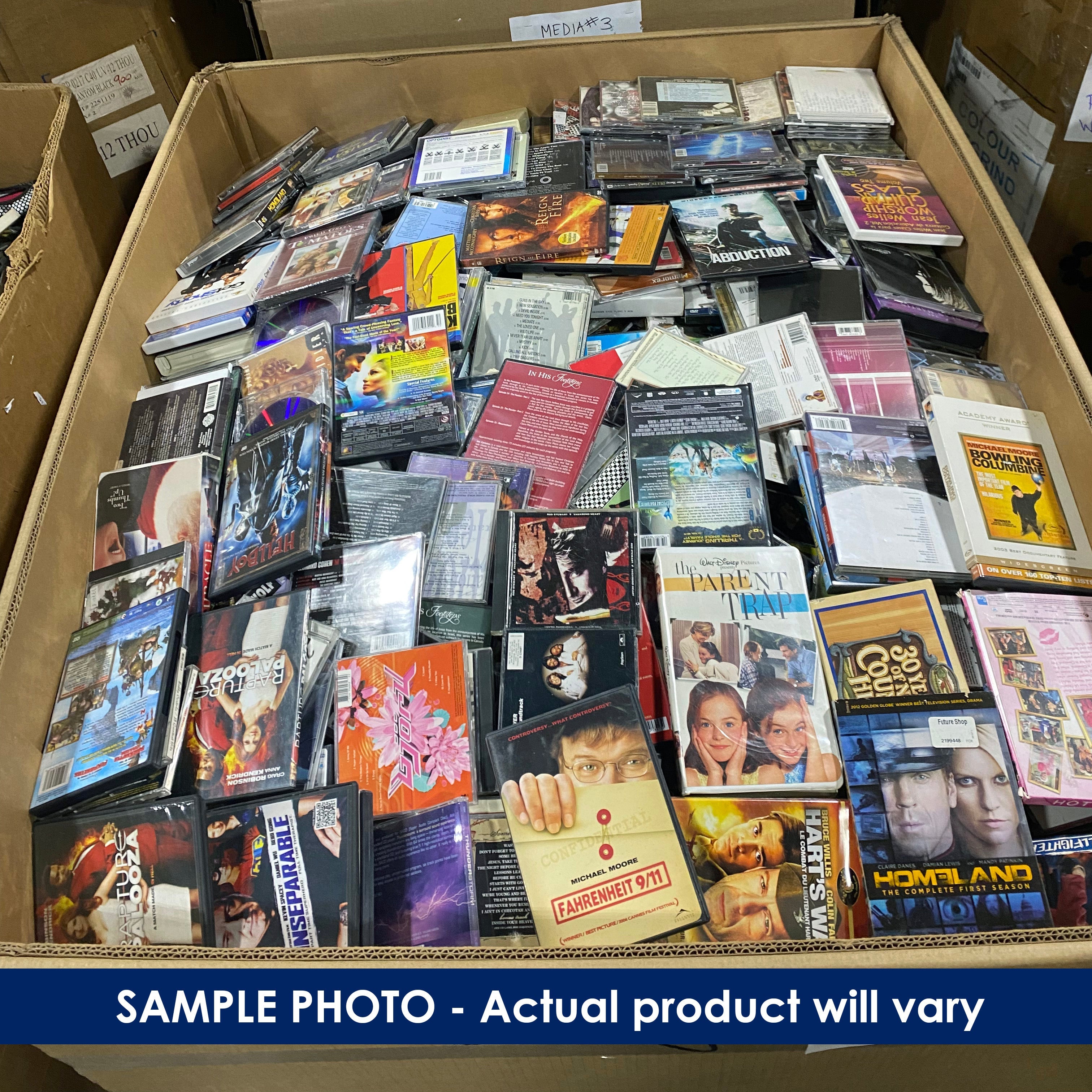 Pallet box filled with various DVDs and movies.
